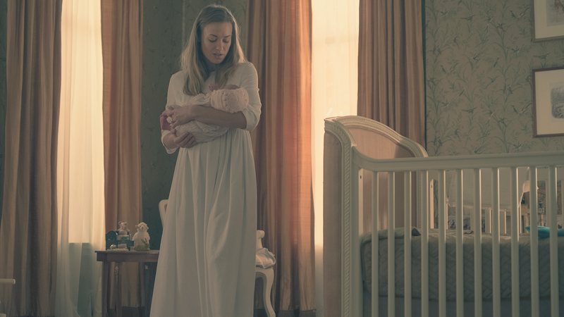 Serena Joy (Yvonne Strahovski) struggles to soothe Holly, now named Nicole.